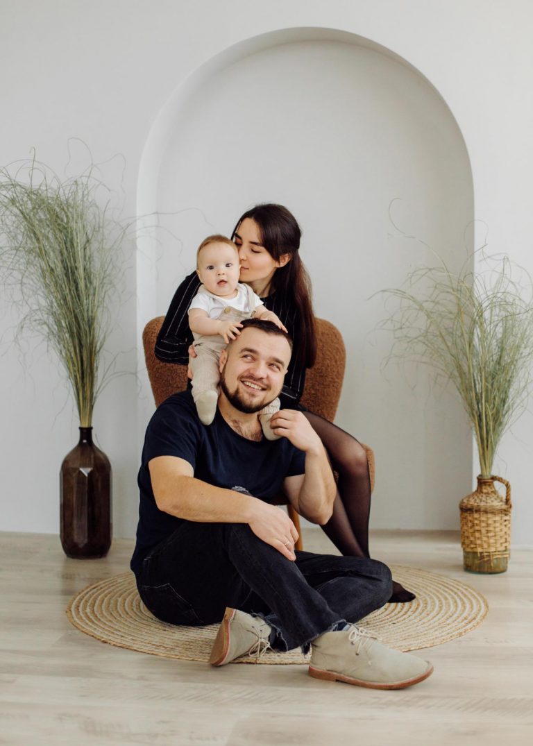 families-portrait-happy-young-mother-father-with-child-posing-home-interior